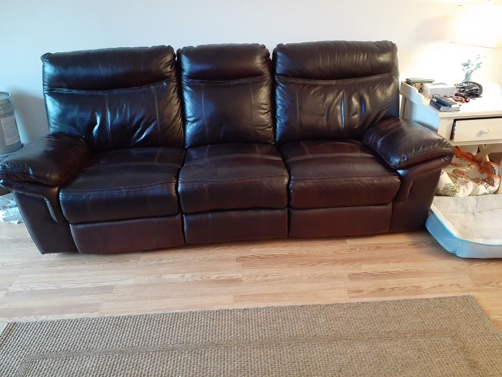 Italian leather reclining sofa ,reclines at both ends of sofa.Good condition,well taken care of!