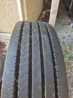 Two Ironman tires 275/70R22.5