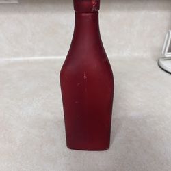 Dark red glass triangle bottle