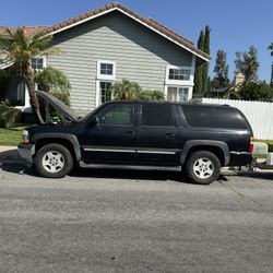 2005 Chevy Suburban With A Good Working Engine, Transmission And Has New Parts  .