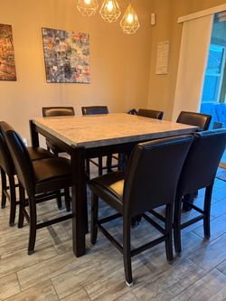 Marble top table $400.00 w/8 leather chairs.