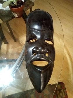 African mask black wood I believe it's from the tribe of Dan .