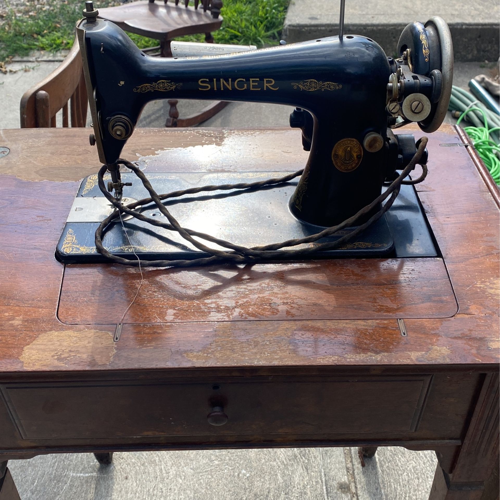 Antique singer sewing machine in nice shape rare to see with the light on it