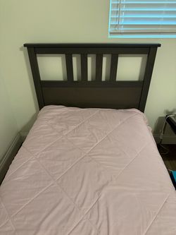 Two ikea twin bed frames w/mattresses