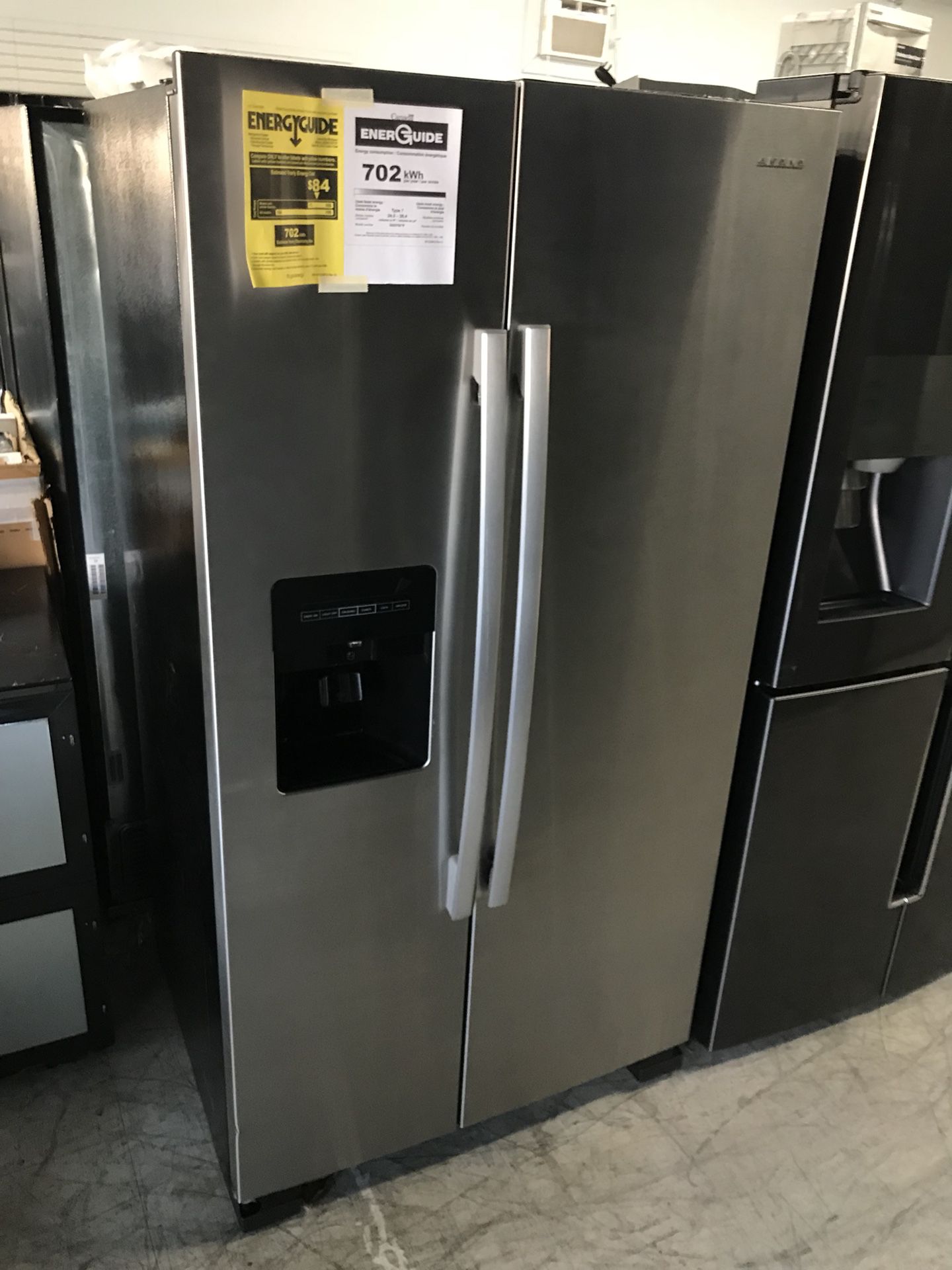 Side by side Amana refrigerator freezer stainless steel