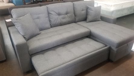 Small sofa chaise sectional with a pullout bed