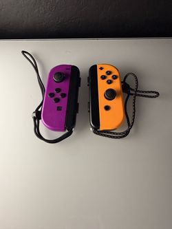 Purple/Orange Nintendo Joy-Cons + straps