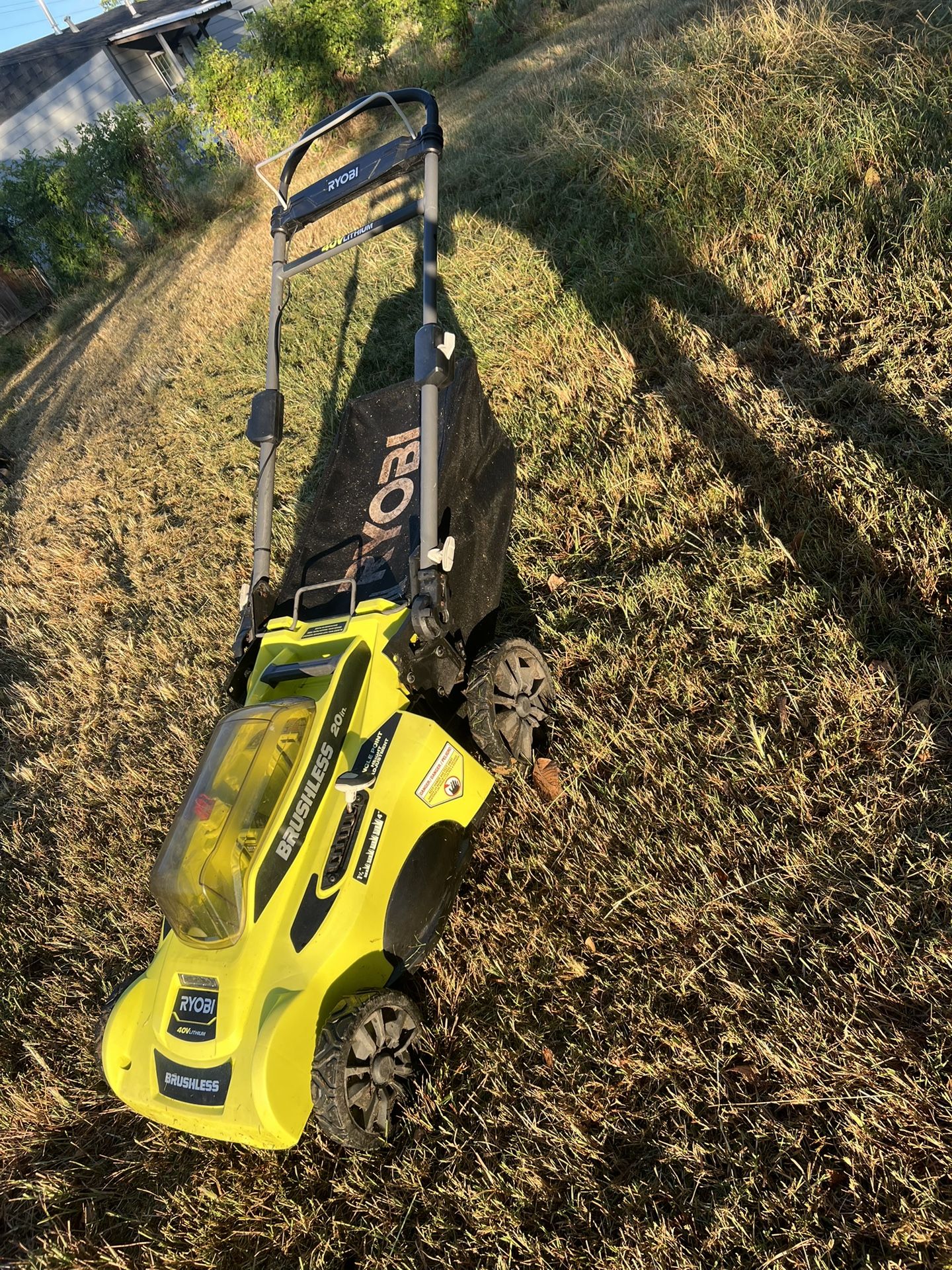 the Ryobi 40V Brushless 20-inch Cordless Battery Walk Behind Push Lawn Mower.