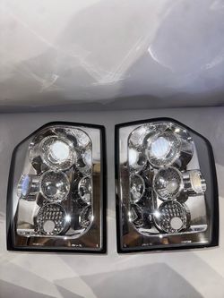 05-06 Jeep Grand Cherokee WK Altezza Style Chrome Housing Taillights