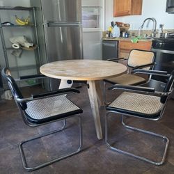 round dining table and 3 chairs