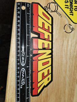 Defender Arcade logo sign