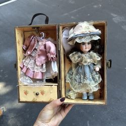 Vintage Style Porcelain Doll with Multiple Outfits