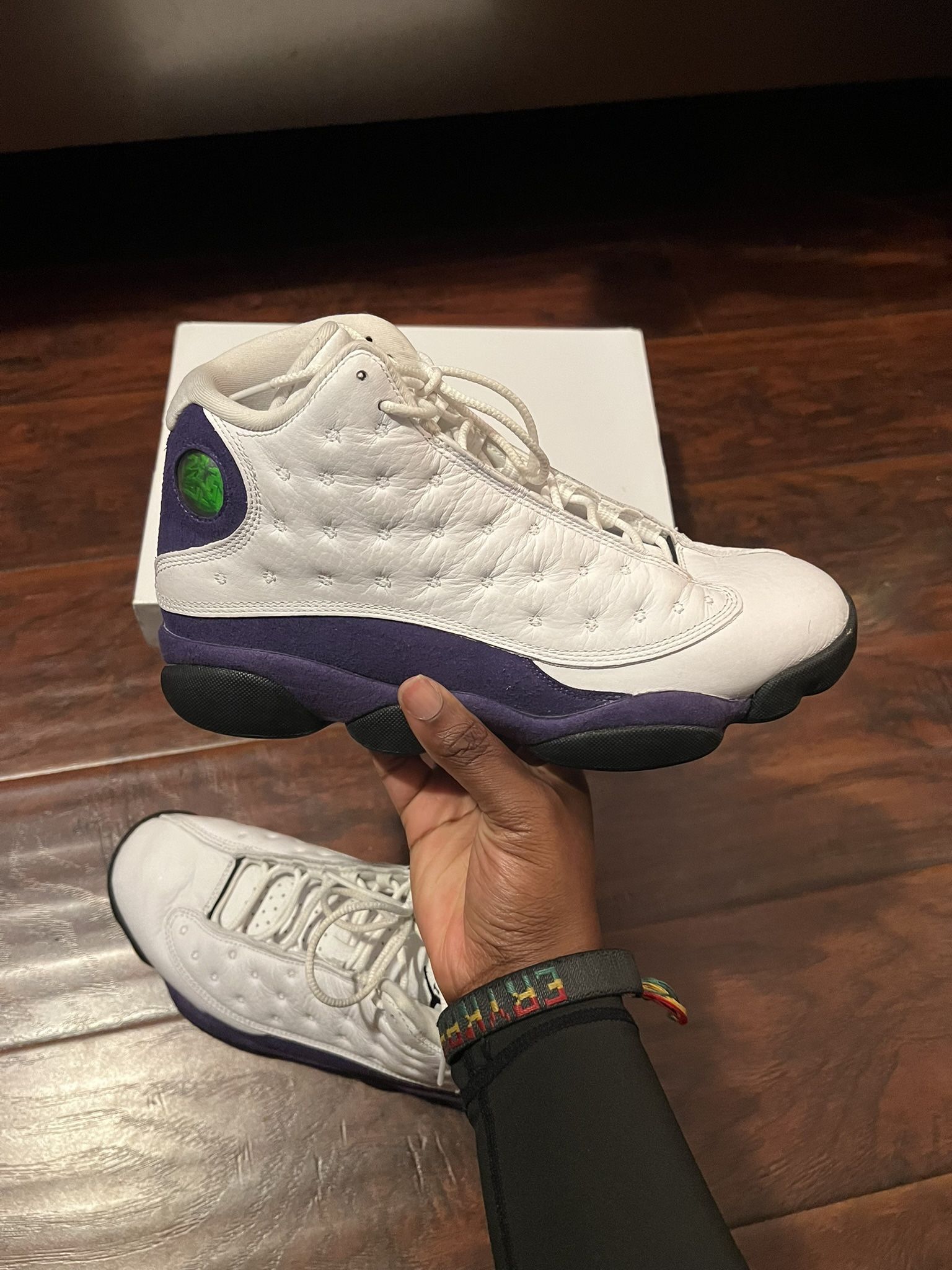 Authentic Air Jordan 13 Retro in the White/Black/Court Purple colorway.