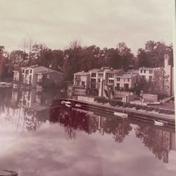 Framed Photograph Of Homes On The Water 