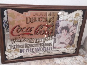 Collectibles Coca-Cola mirror.