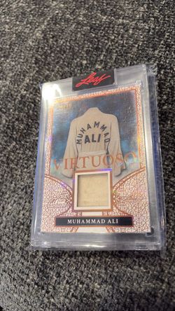 Muhammad Ali Leaf with piece of worn memorabilia.