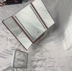 two makeup mirrors