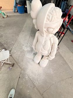 Kaws statue made out of cement