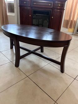 Coffee table with a brown wooden finish
