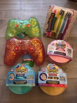 Five below RMS cotton candy dumpling shark glitter rainbow cake controller squishy