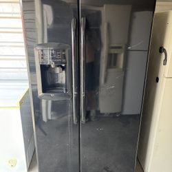 Black GE Refrigerator And Freezer
