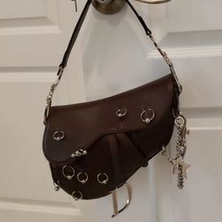 AUTHENTIC early 2000s y2k Dior pierced hardcore saddle shoulder bag in Hershey chocolate brown leather.