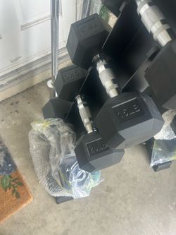 New set of dumbbells 10 pounder 15 pounders 20 pounders 25 pounder and a 30 pounder it comes with a tree rock altogether 200 pounds
