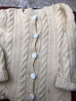 Vintage knitted girl’s buttoned sweater.