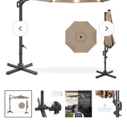 Outdoor 10’ tan umbrella cantilever, offset with weighted base