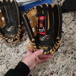 Two Pairs Or Rawlings Player Series Catcher Gloves
