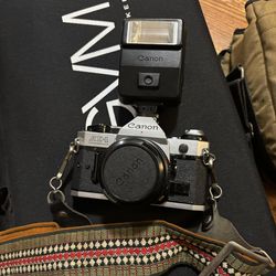 Canon AE-1 Program 35mm SLR Film Camera with 50 mm lens Kit And Speedlite 155A