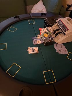 Round Poker Table with Chips and Cards