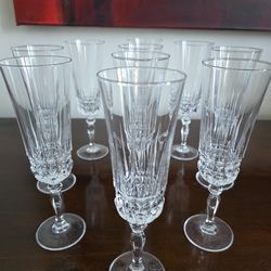 Set of ten crystal champagne flutes with vertical cut pattern by Cristal d'Arques