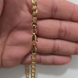 Used 22" 14k solid gold 17g cuban necklace.