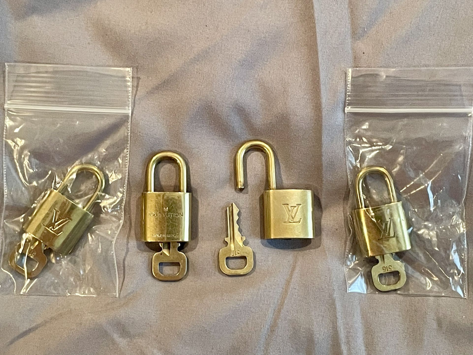 Louis Vuitton padlock and key (4 Available)