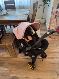 Light pink Doona stroller & car seat