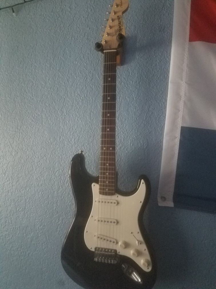 fender starcaster black and white guitar
