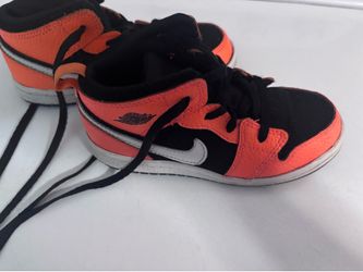 Orange and black Jordan 1 toddler sneakers