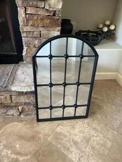 Iron paneled mirror