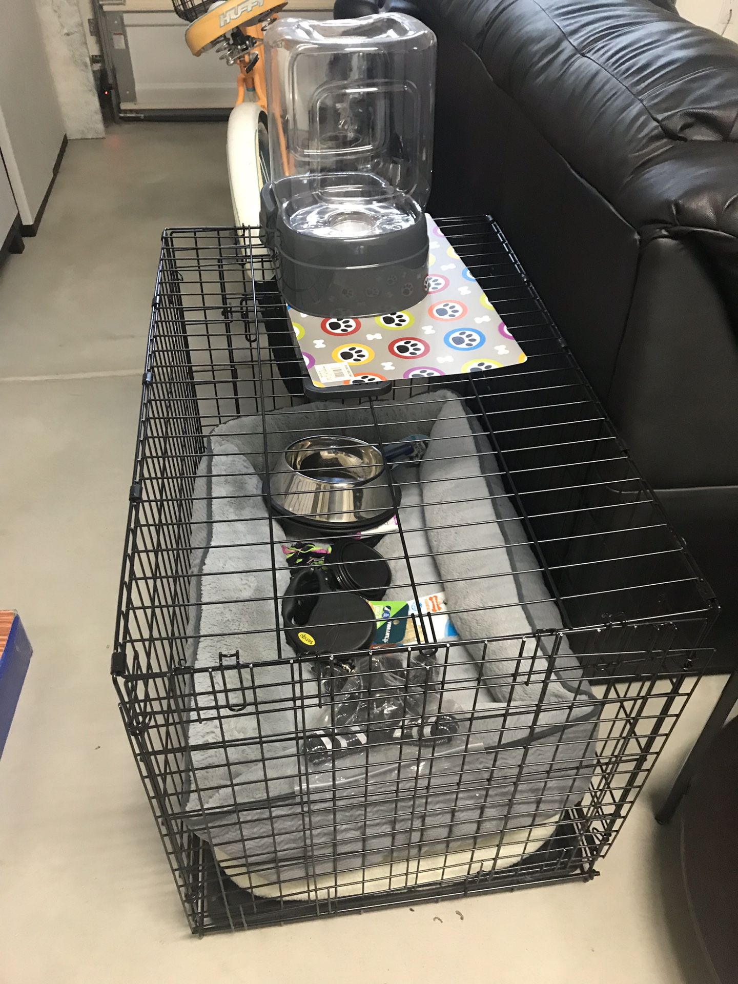 dog crate, bed, bowls, etc