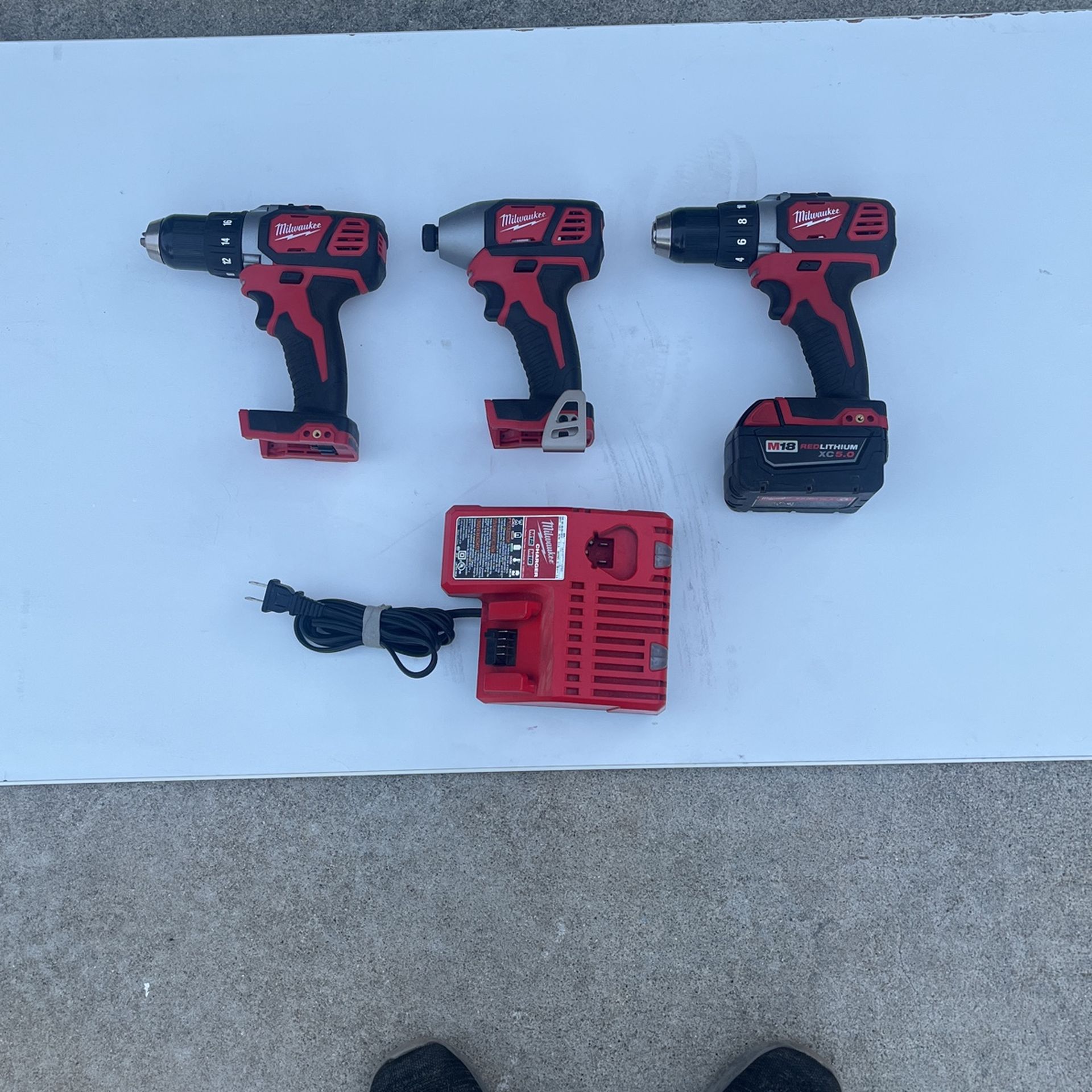 M 18 MILWUAKEE TWO 1/2” DRILLS AND 1 IMPACT WRENCH.