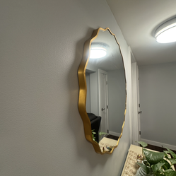 Gold wall mirror