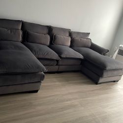 Gray Small Sectional With Two Grey Chairs