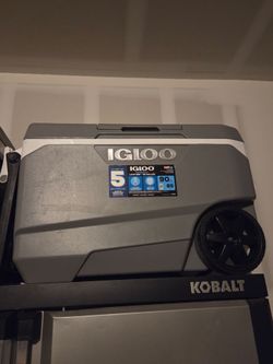 Igloo 90 can with rolling wheels.