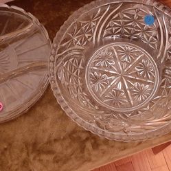 Glass serving dishes with decorative patterns.