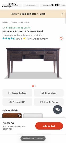 Dark wood desk with outlets