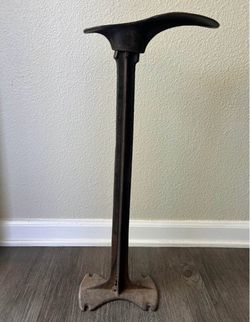 Old antique cobbler shoe stand