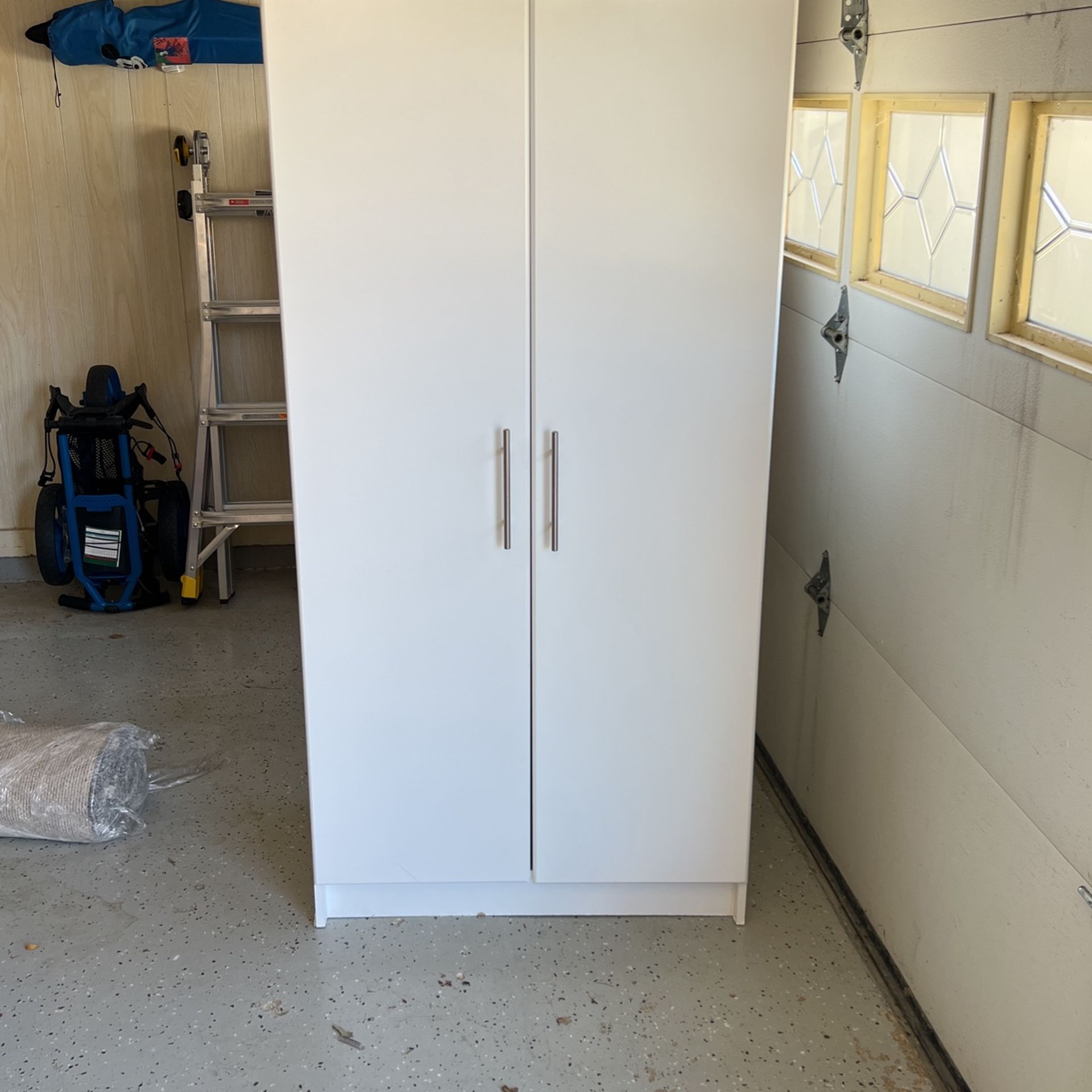 White Cabinet Shelving And Hanging Rod 