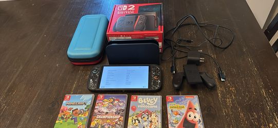 Like new Nintendo switch 2 with case,carry case and 4 games