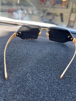 Prada Rimless Sunglasses with Gold Metal Arms